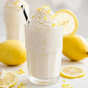Refreshing whipped lemonade, the ultimate summer delight, served in a glass.
