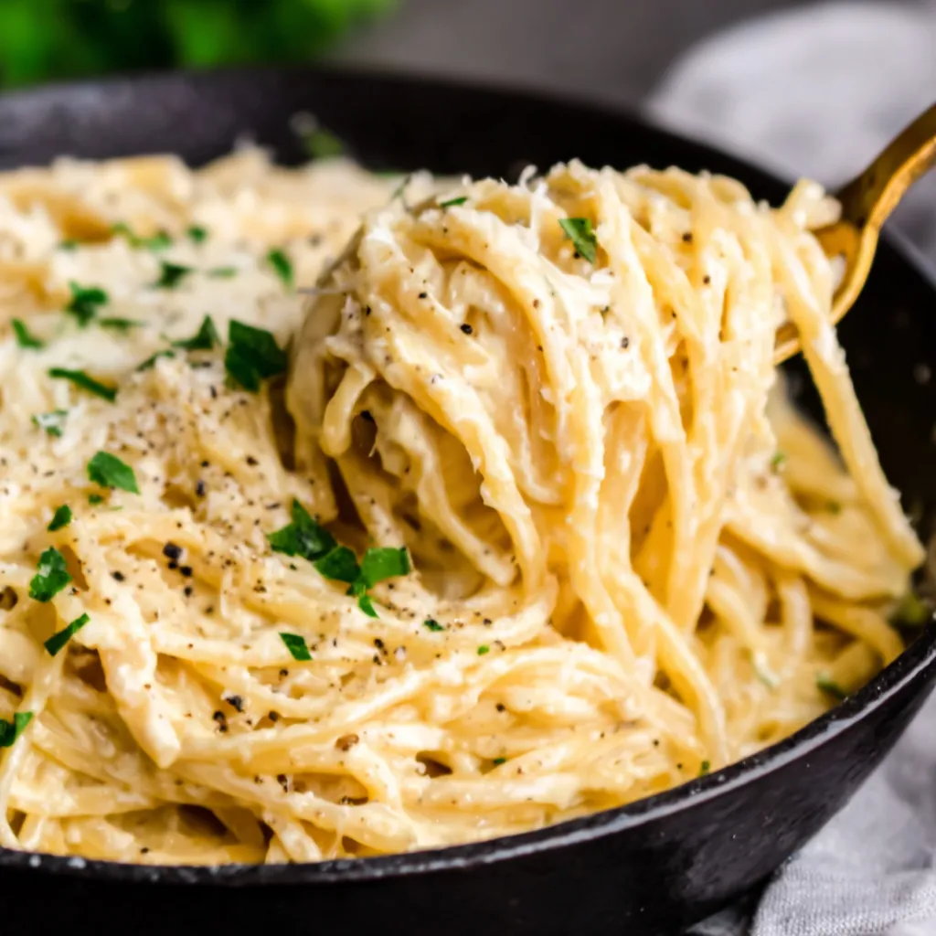 Close-up of Creamy Garlic Parmesan Spaghetti, showcasing its creamy texture and rich sauce.
